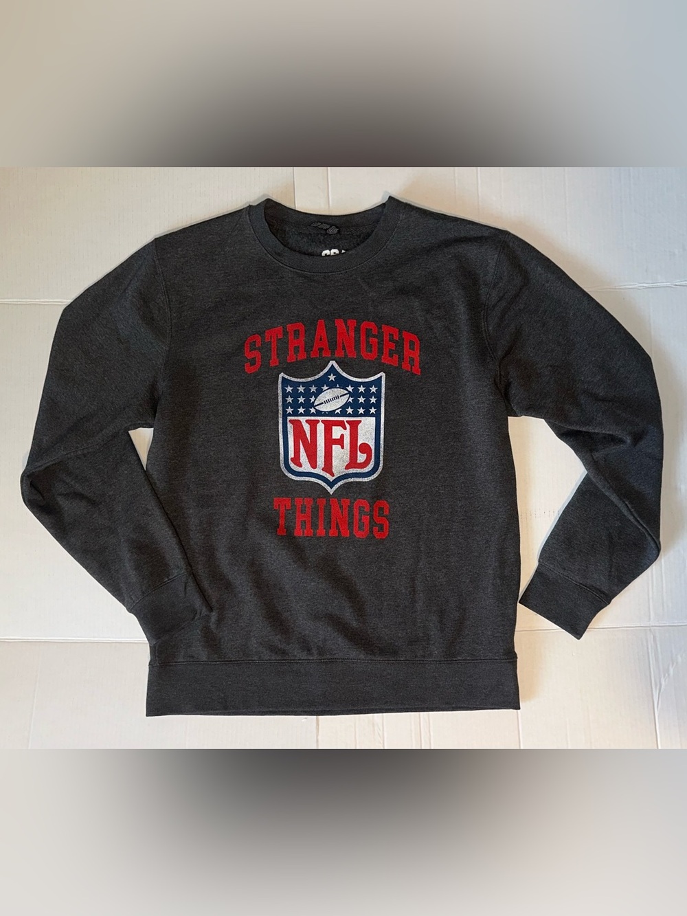 NFL Stranger Things Black Crewneck Sweatshirt with Red and White Logo